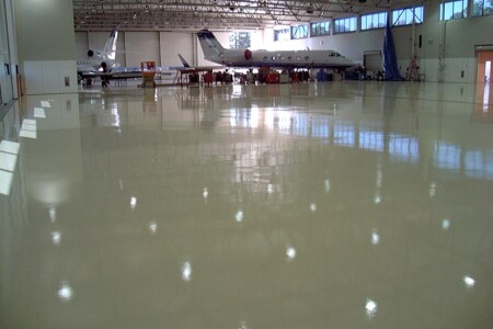 Glossy Resinous Flooring in airplane hangar