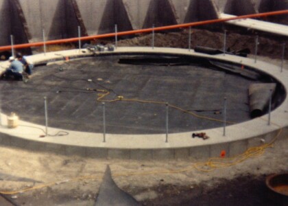 Installing a plastic liner to top of large tank