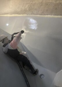 Spray application of tank lining