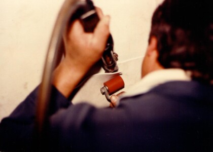 Applying adhesive to plastic tank liner