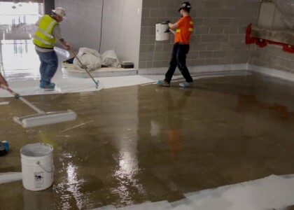 Application of waterproofing chemicals to parking deck floor