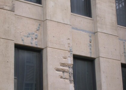 Repairing holes in concrete exterior