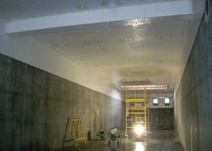 Interior view of plastic liner being applied to ceiling