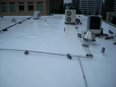 Our roof coating system can often eliminate tear-offs and encapsulate asbestos-containing materials in place