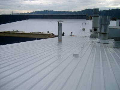 Light grey roof coating on a metal roof