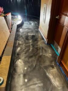 Closeup view of high gloss dark gray resinous flooring