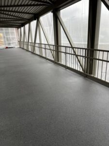Side view of the Bellevue Square Skywalk with new gray resinous flooring. Side view of the Bellevue Square Skywalk with new gray resinous flooring.