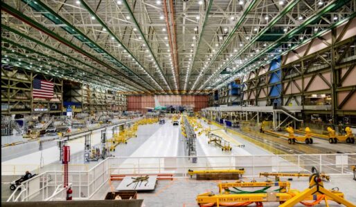 High-angle view of a Boeing facility in Everett with an ElectroStatic Dissipative floor. An electrostatic dissipative floor is a specially engineered flooring system that safely drains static electricity from people and objects to an electrical ground so it cannot build up and discharge into sensitive equipment