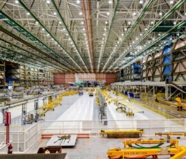 High-angle view of a Boeing facility in Everett with an ElectroStatic Dissipative floor. An electrostatic dissipative floor is a specially engineered flooring system that safely drains static electricity from people and objects to an electrical ground so it cannot build up and discharge into sensitive equipment